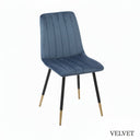Blue velvet chair with black legs on a white background