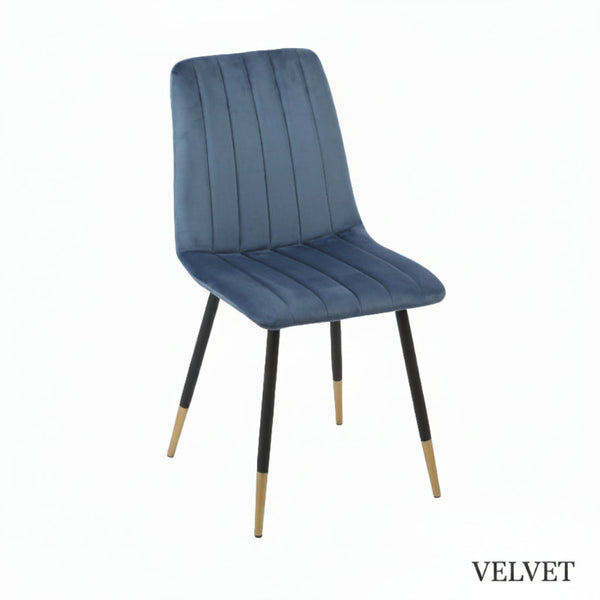 Blue velvet chair with black legs on a white background