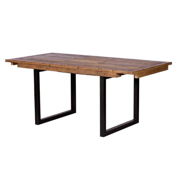 Wooden dining table with black metal legs on a white background