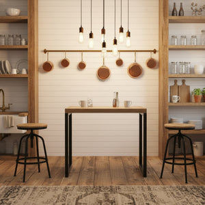 Table with wooden top and black metal legs with stools in a room setting