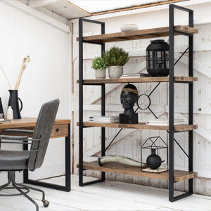 Home office with wooden desk, chair, and bookshelf against a white wall.