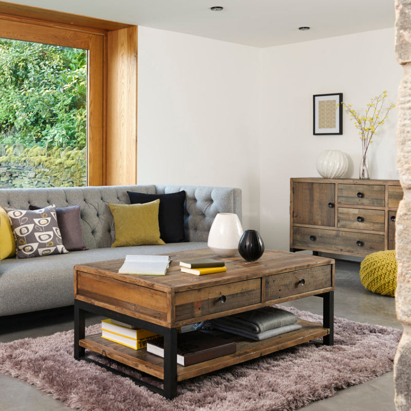 Wooden coffee table with two drawers on a white background