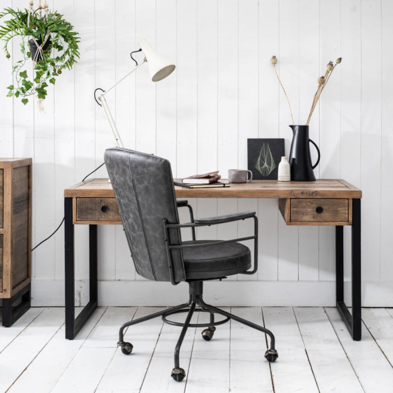 Wooden desk with black metal legs on a white background