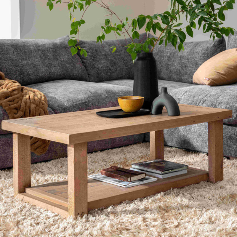 Wooden coffee table with a shelf on a white background