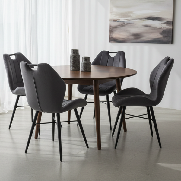 Gray upholstered chair with black metal legs on a white background