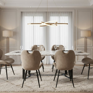Beige upholstered chair with black metal legs on a white background