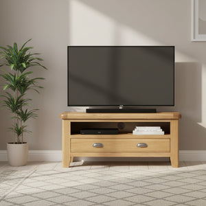 Wooden TV stand with two drawers on a white background