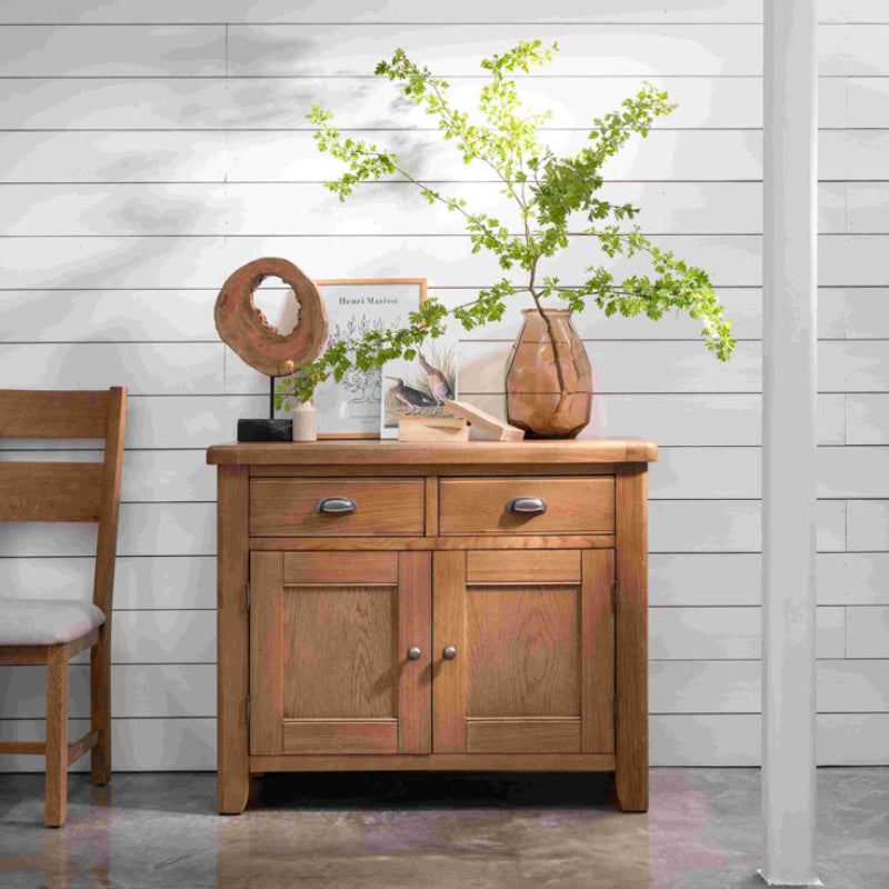 Wooden sideboard with two drawers and two doors on a white background