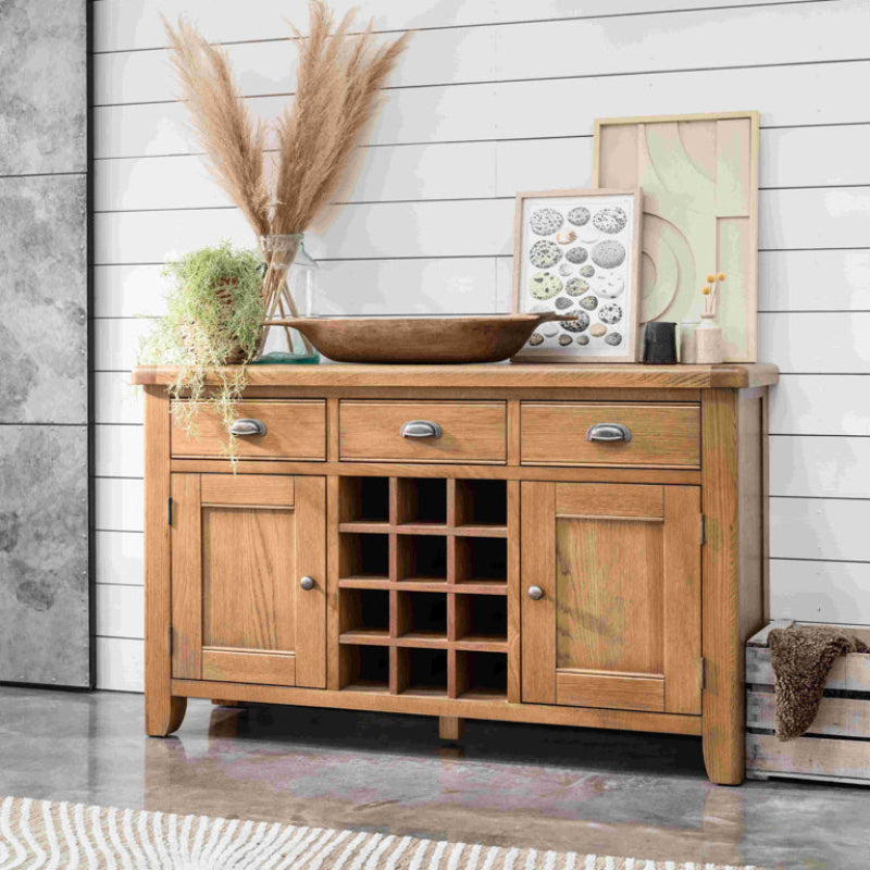 Wooden sideboard with storage compartments on a white background