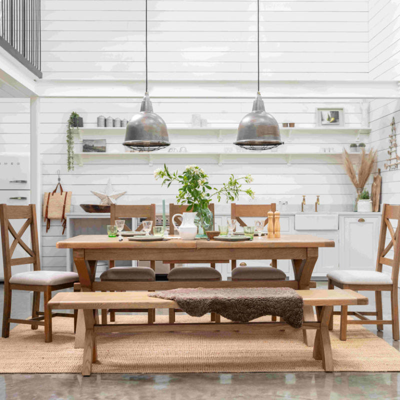 Wooden bench with X-shaped legs on a white background