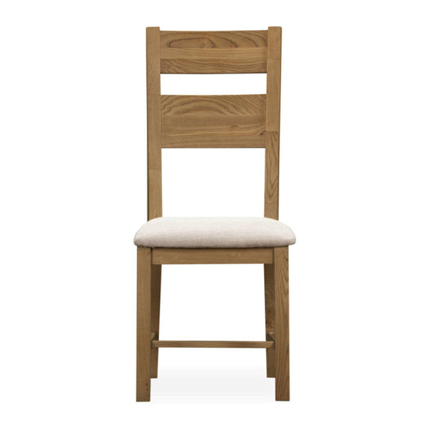 Wooden chair with a white cushion on a white background
