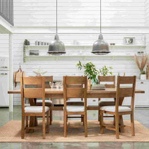 Wooden dining table with chairs in a modern kitchen setting