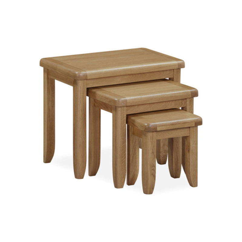 Set of three wooden nesting tables on a white background