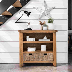 Wooden shelf with decorative items against a white wall with star decor.